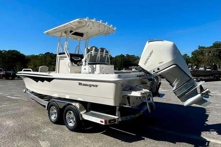 Slide: The Image of 2026 Ranger 2360 Bay boat with Mercury engine on trailer, parked outdoors. - 7