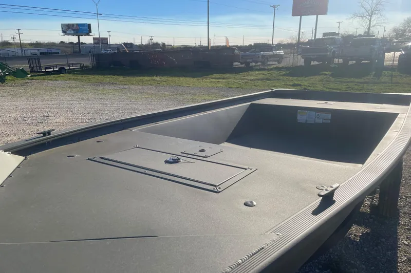 Slide: The Image of 2026 Tracker Grizzly 1648 Utility boat in outdoor setting, showcasing spacious deck design. - 5