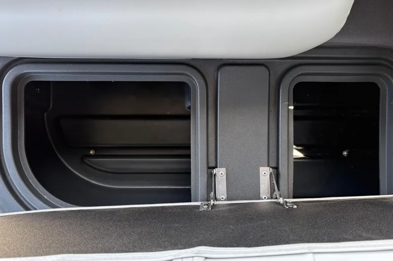 Slide: The Image of Storage compartments in a 2026 Sun Tracker Fishin' Barge 22 XP3 boat interior. - 48