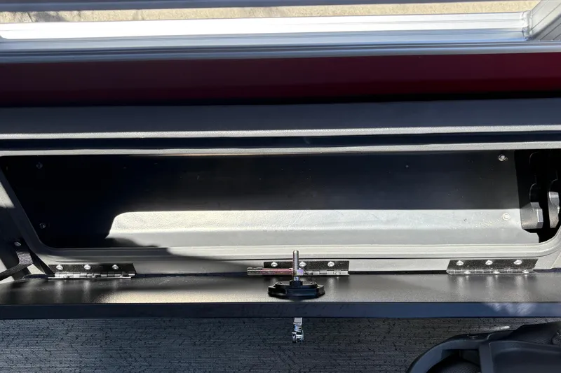 Slide: The Image of Storage compartment of 2026 Sun Tracker Fishin' Barge 22 XP3, featuring durable construction. - 35