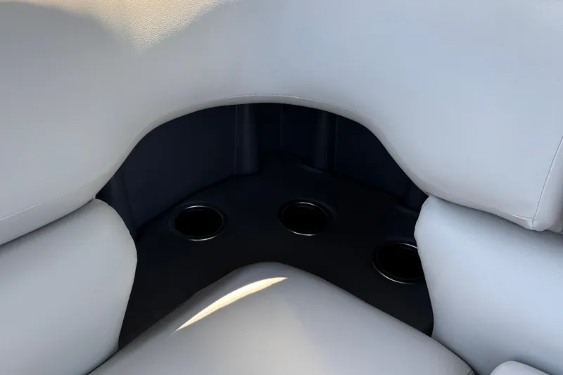 Slide: The Image of Interior seating with cup holders on 2026 Sun Tracker Fishin' Barge 22 XP3. - 16