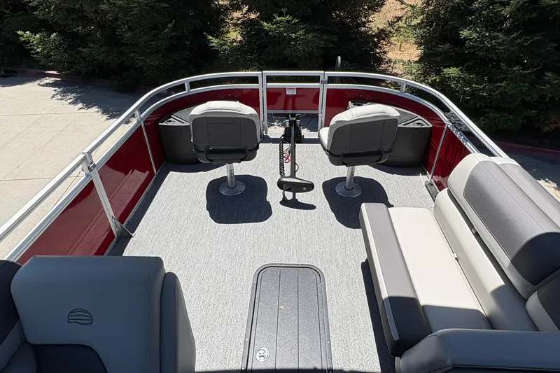 Slide: The Image of 2026 Sun Tracker Fishin' Barge 22 XP3 interior with seating and fishing setup. - 11