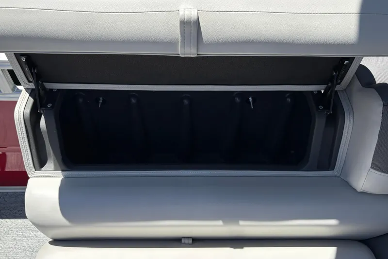 Slide: The Image of Open storage compartment in 2026 Sun Tracker Fishin' Barge 22 XP3 boat seat. - 37