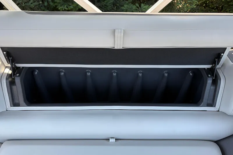 Slide: The Image of Storage compartment in 2026 Sun Tracker Fishin' Barge 22 XP3 boat, open and empty. - 44