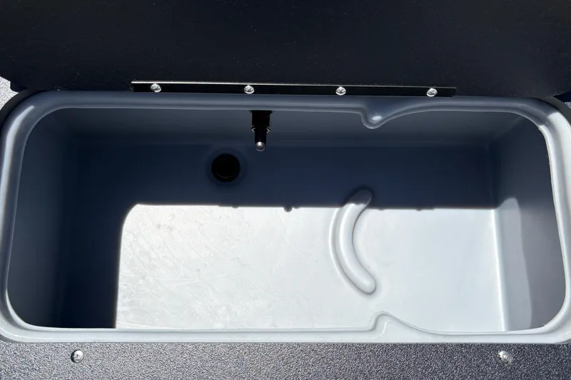 Slide: The Image of Livewell compartment of 2026 Sun Tracker Fishin' Barge 22 XP3, featuring a spacious interior. - 28