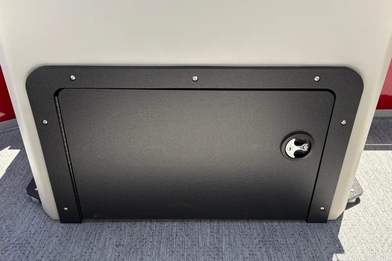 Slide: The Image of Storage compartment on 2026 Sun Tracker Fishin' Barge 22 XP3 boat, featuring a secure latch. - 42