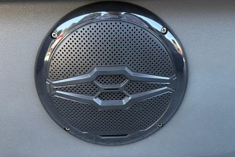 Slide: The Image of Speaker grille on 2026 Sun Tracker Fishin' Barge 22 XP3 boat dashboard. - 45