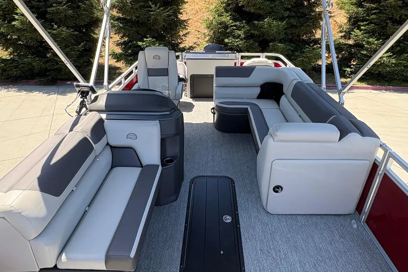 Slide: The Image of 2026 Sun Tracker Fishin' Barge 22 XP3 interior with spacious seating and modern design. - 10