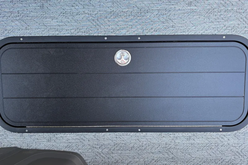Slide: The Image of Hatch cover on 2026 Sun Tracker Fishin' Barge 22 XP3, featuring sleek design and secure latch. - 46