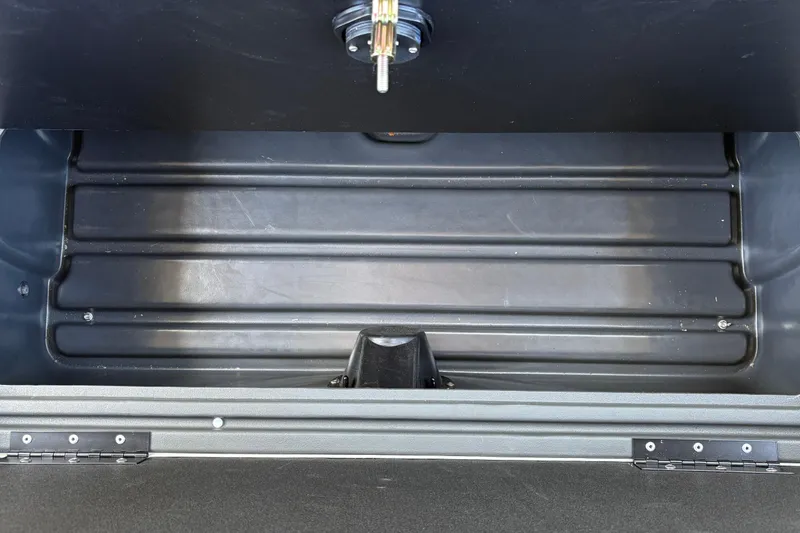 Slide: The Image of Storage compartment of 2026 Sun Tracker Fishin' Barge 22 XP3, featuring durable construction. - 49