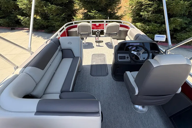 Slide: The Image of 2026 Sun Tracker Fishin' Barge 22 XP3 interior with seating and steering console. - 7