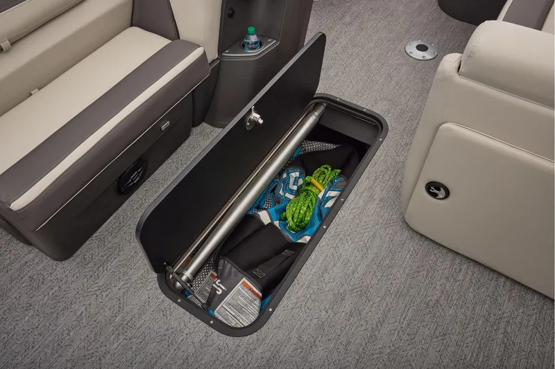 Slide: The Image of 2026 Sun Tracker Fishin' Barge 22 XP3 boat deck with storage and cup holders. - 34