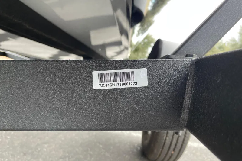 Slide: The Image of 2026 Tracker Pro Team 175 Crappie Edition trailer with visible barcode and serial number. - 25