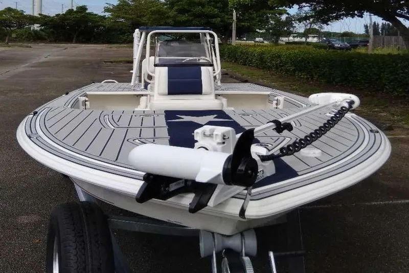 Slide: The Image of 2026 Mako 18 Pro Skiff Patriot Edition boat with sleek design and advanced features. - 2