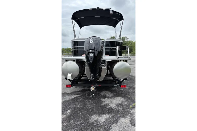 Slide: The Image of 2026 Sun Tracker Party Barge 22 XP3 pontoon boat with outboard motor, rear view. - 4