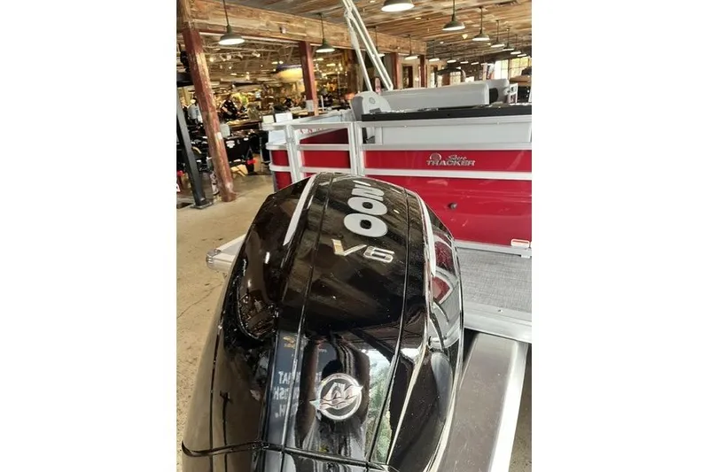 Slide: The Image of 2026 Sun Tracker SportFish 22 XP3 with powerful V6 engine in showroom. - 4