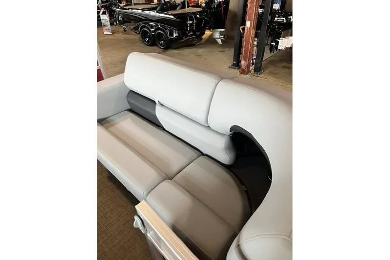Slide: The Image of 2026 Sun Tracker SportFish 22 XP3 boat interior with gray seating in showroom. - 10