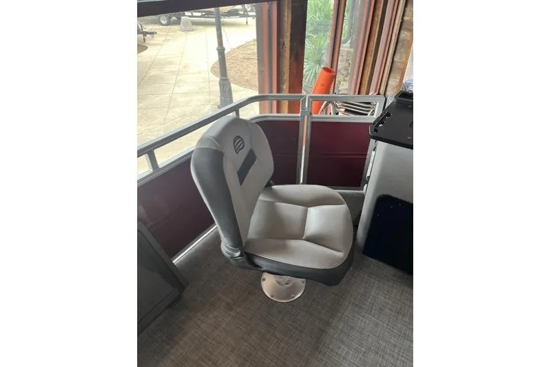 Slide: The Image of Sun Tracker SportFish 22 XP3 2026 boat seat, gray upholstery, indoor setting. - 7