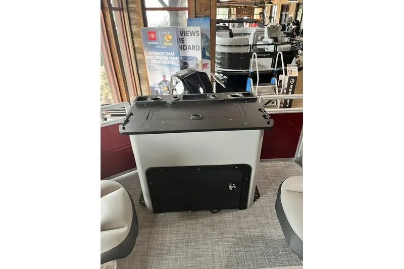 Slide: The Image of 2026 Sun Tracker SportFish 22 XP3 boat interior with seating and control panel. - 3