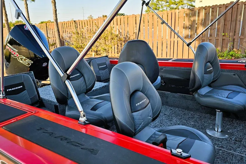 Slide: The Image of 2026 Tracker Targa V-19 Combo boat interior with foot pedal and wiring details. - 10