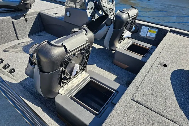 Slide: The Image of 2026 Tracker Bass Tracker Classic XL boat interior with seating and storage compartments. - 13