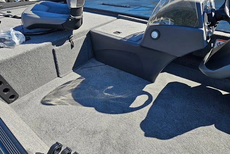 Slide: The Image of 2026 Tracker Bass Tracker Classic XL boat interior with seating and console. - 14