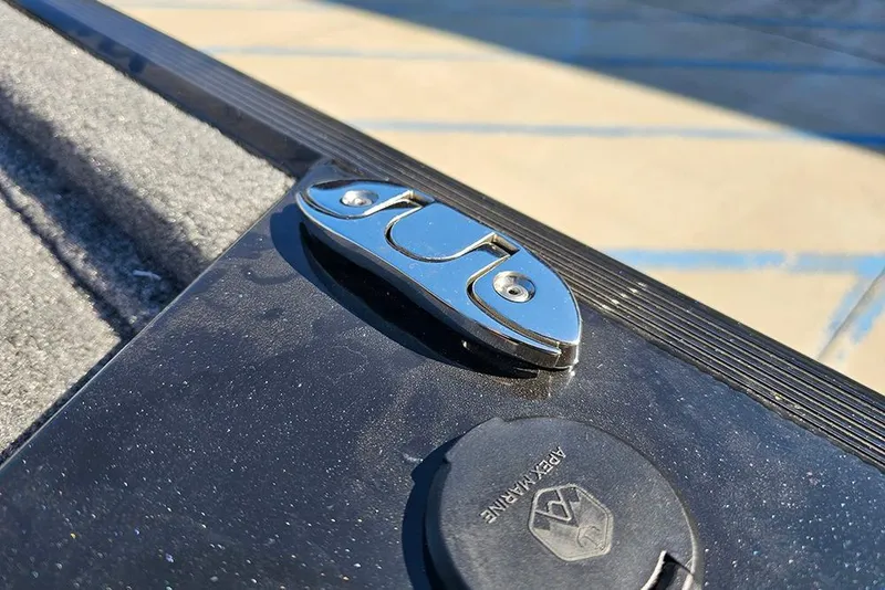 Slide: The Image of Close-up of a 2026 Tracker Bass Tracker Classic XL boat latch and accessory port. - 18