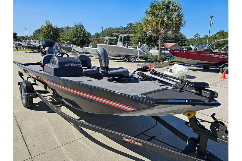 Slide: The Image of 2026 Tracker Bass Tracker Classic XL boat on trailer, parked outdoors. - 5