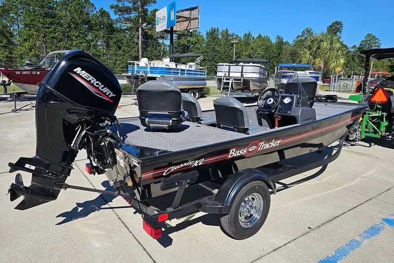 Slide: The Image of 2026 Tracker Bass Tracker Classic XL boat with Mercury engine on display. - 7
