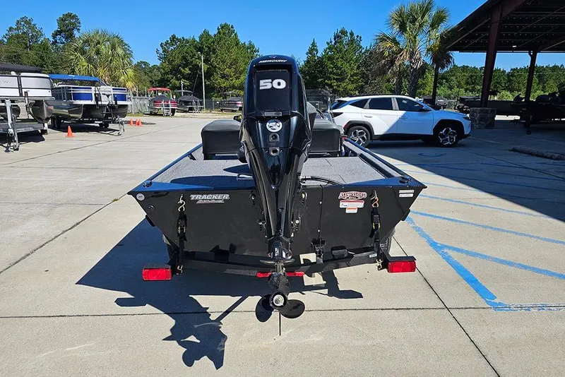 Slide: The Image of 2026 Tracker Bass Tracker Classic XL boat with Mercury 50 engine in a parking lot. - 8