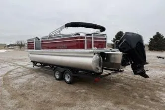 Slide: The Image of 2026 Sun Tracker SportFish 22 XP3 pontoon boat on trailer in outdoor setting. - 3