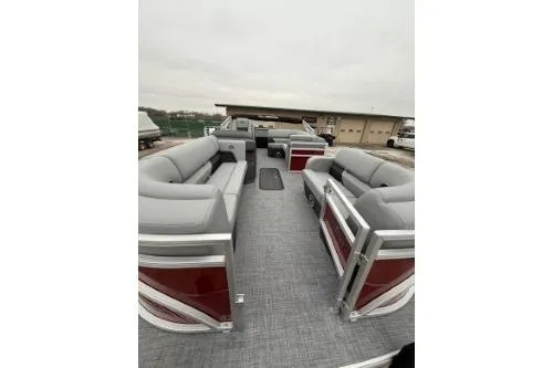 Slide: The Image of 2026 Sun Tracker SportFish 22 XP3 pontoon boat with spacious seating and modern design. - 6