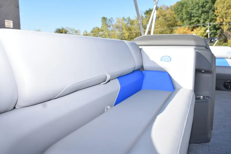 Slide: The Image of 2026 Sun Tracker Party Barge 20 DLX interior seating with blue accents. - 15