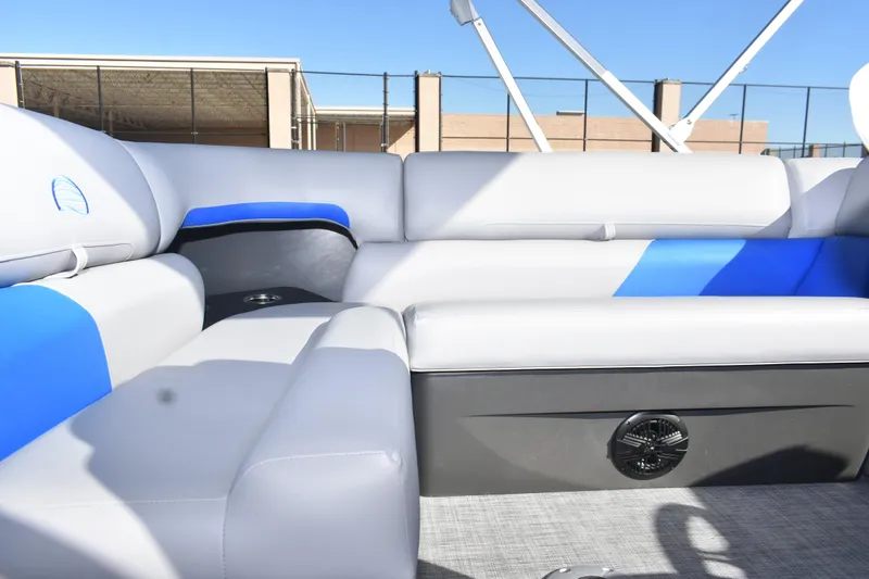 Slide: The Image of 2026 Sun Tracker Party Barge 20 DLX interior with gray and blue seating. - 17