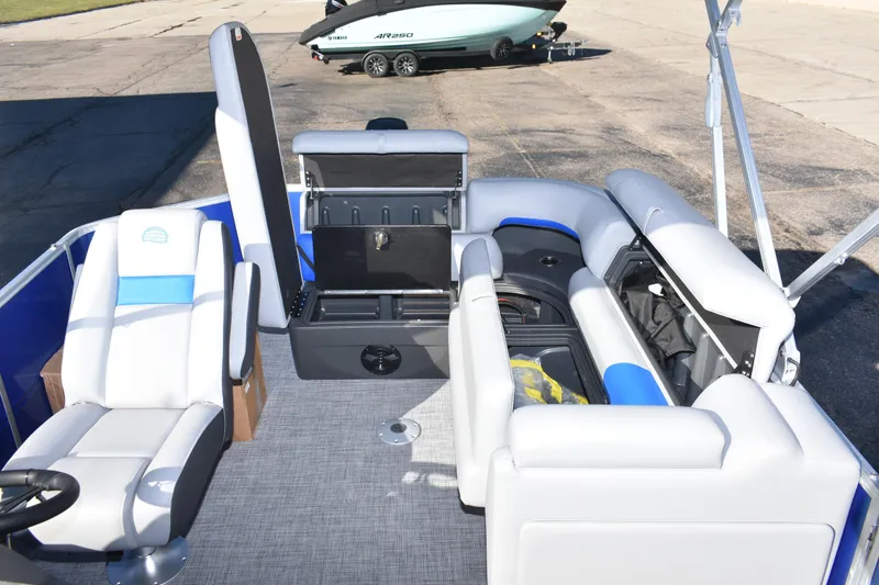 Slide: The Image of 2026 Sun Tracker Party Barge 20 DLX interior with seating and storage compartments. - 22