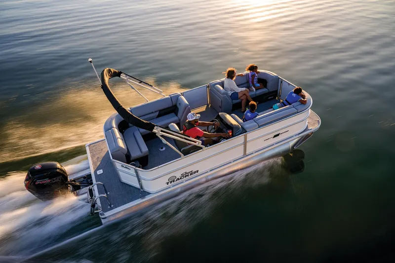 Slide: The Image of Manufacturer Provided Image: 2026 Sun Tracker Party Barge 20 DLX cruising on calm water at sunset. - 27