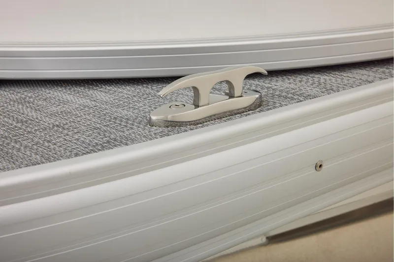 Slide: The Image of Manufacturer Provided Image: 2026 Sun Tracker Party Barge 20 DLX boat cleat on textured deck surface. - 43