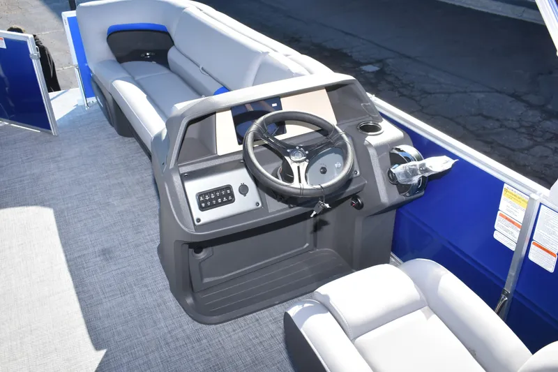 Slide: The Image of 2026 Sun Tracker Party Barge 20 DLX interior with steering console and seating. - 9