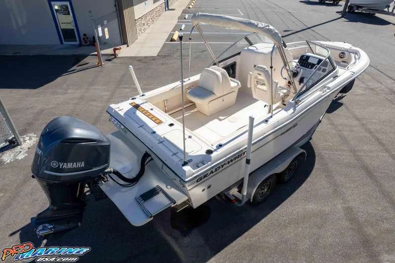 Slide: The Image of 2016 Grady-White Freedom 225 boat with Yamaha engine on trailer in parking lot. - 14