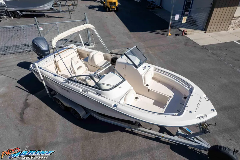 Slide: The Image of 2016 Grady-White Freedom 225 boat on trailer in a marina lot. - 21