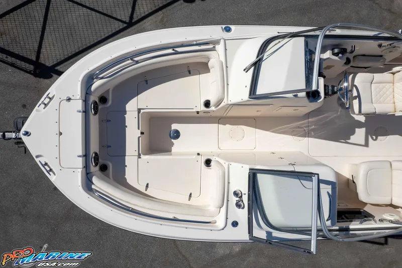 Slide: The Image of 2016 Grady-White Freedom 225 boat interior, aerial view, showcasing seating and helm area. - 23