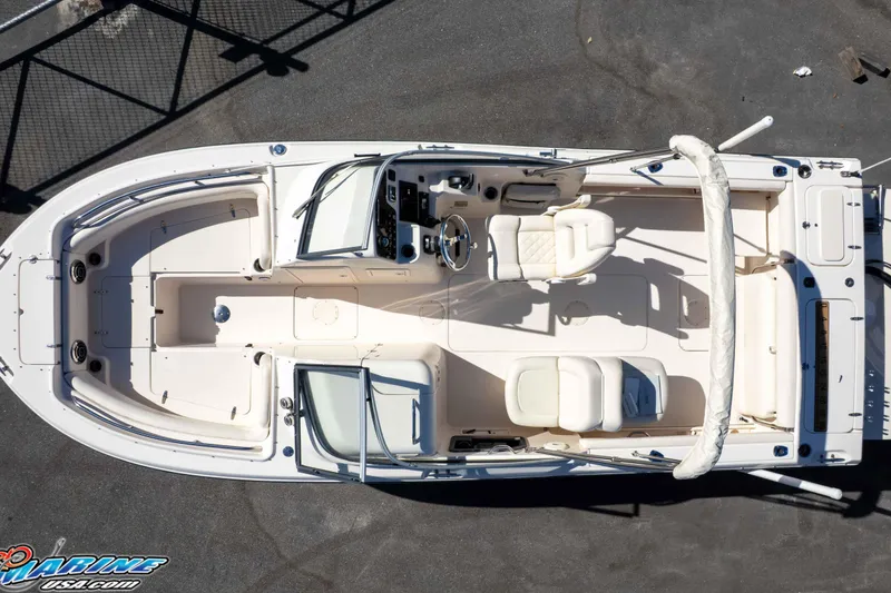Slide: The Image of 2016 Grady-White Freedom 225 boat, aerial view, showcasing spacious seating and helm area. - 24