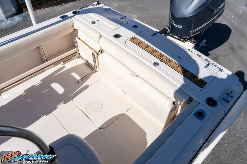 Slide: The Image of 2016 Grady-White Freedom 225 boat interior with Yamaha 300 engine. - 25