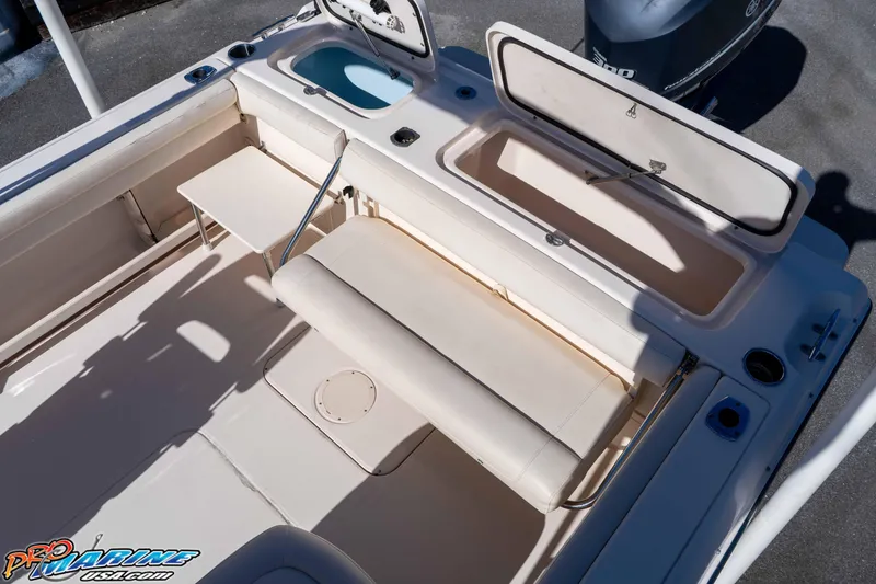 Slide: The Image of 2016 Grady-White Freedom 225 boat interior with seating and storage compartments. - 27