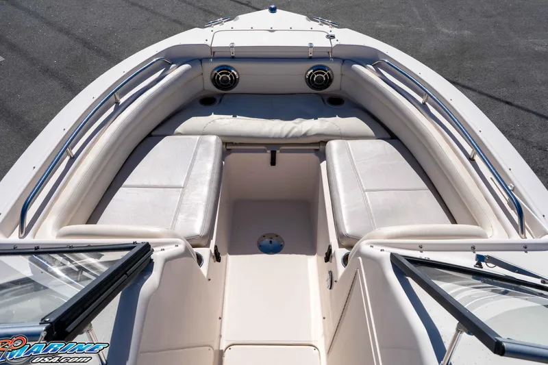 Slide: The Image of 2016 Grady-White Freedom 225 boat interior with cushioned seating and stainless steel railings. - 35