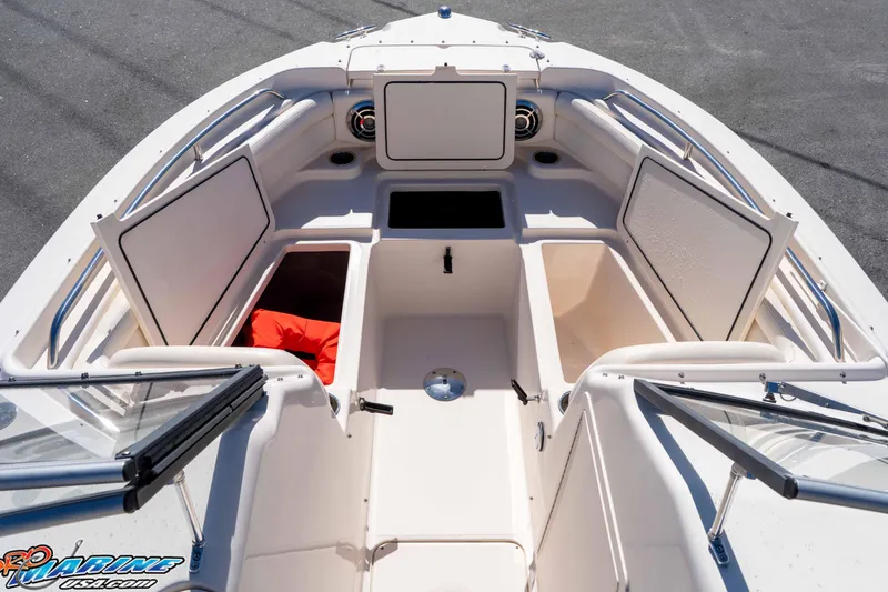 Slide: The Image of 2016 Grady-White Freedom 225 boat interior with open storage compartments. - 36