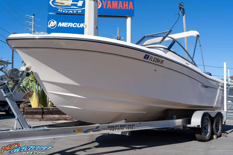 Slide: The Image of 2016 Grady-White Freedom 225 boat on trailer, displayed at dealership. - 4