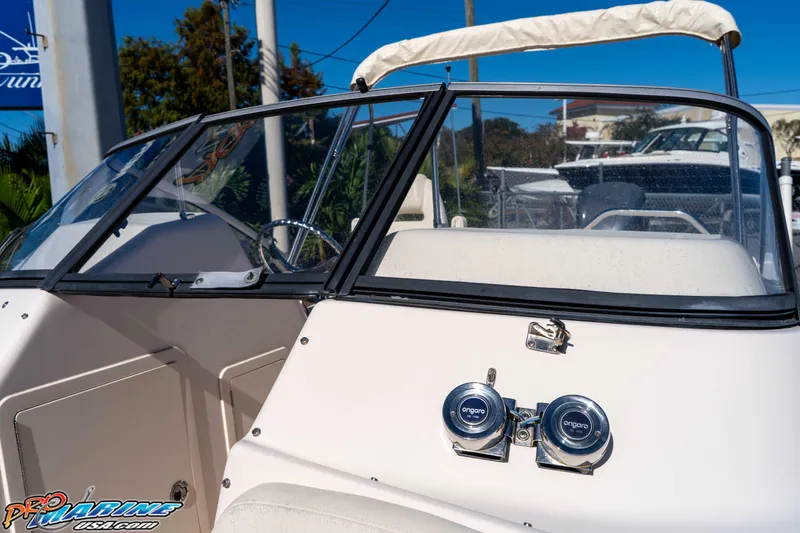 Slide: The Image of 2016 Grady-White Freedom 225 boat interior with windshield and steering wheel. - 41