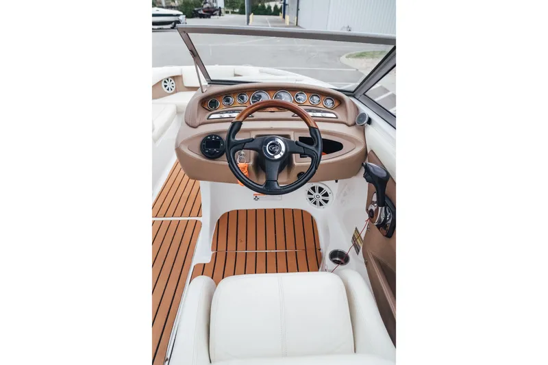 Slide: The Image of 2008 Cobalt 202 boat interior with steering wheel and dashboard controls. - 11