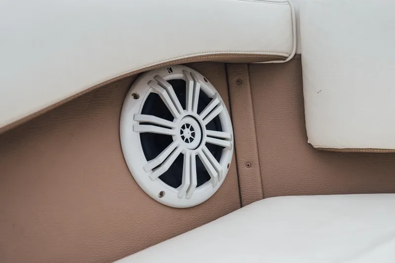 Slide: The Image of Speaker embedded in beige and white upholstery of a 2008 Cobalt 202 boat. - 18